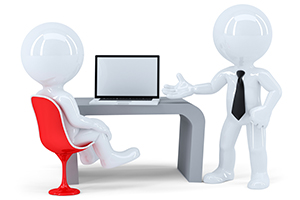 Two male figures near a desk with a laptop